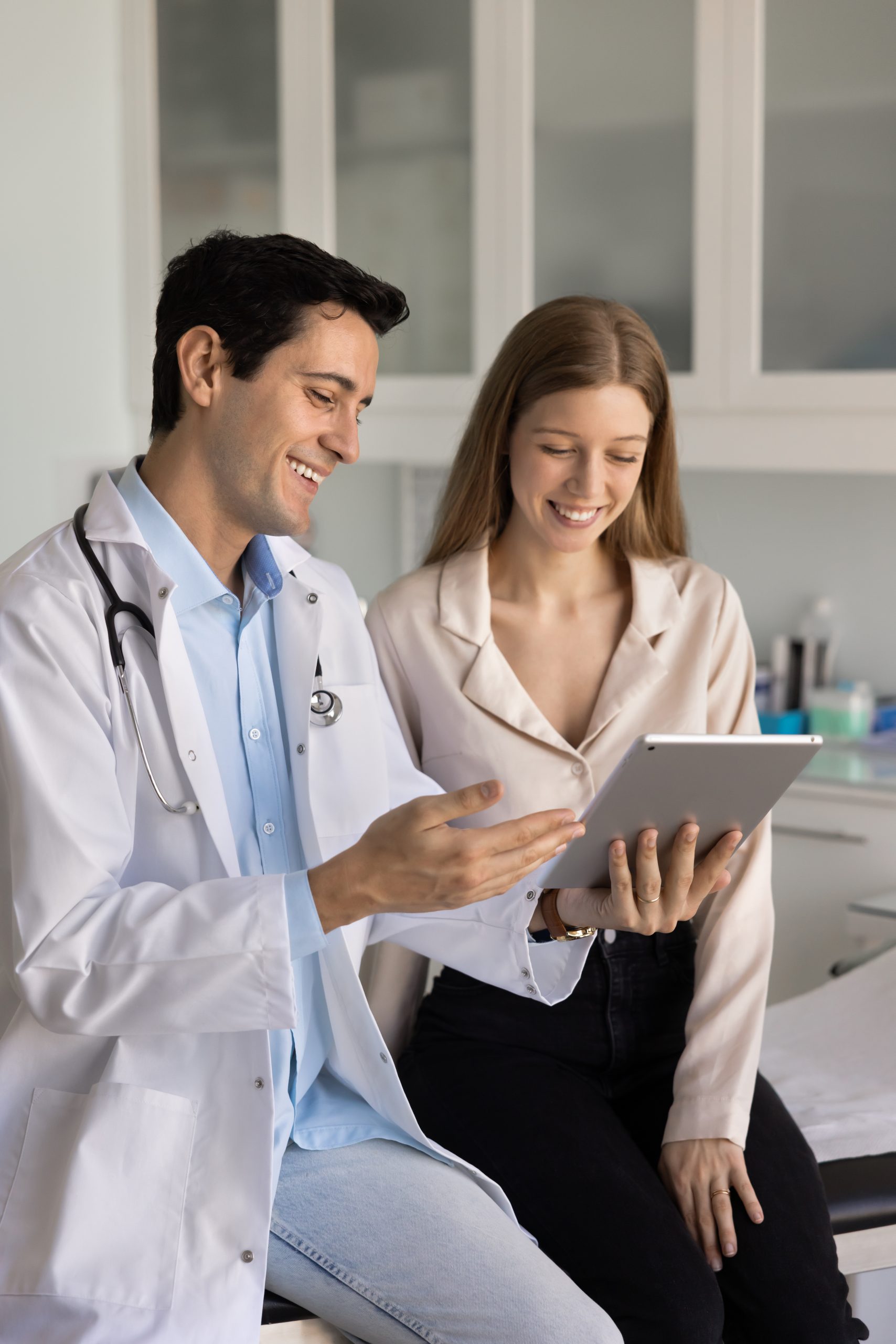 doctor discussing scanning results on tablet with patient