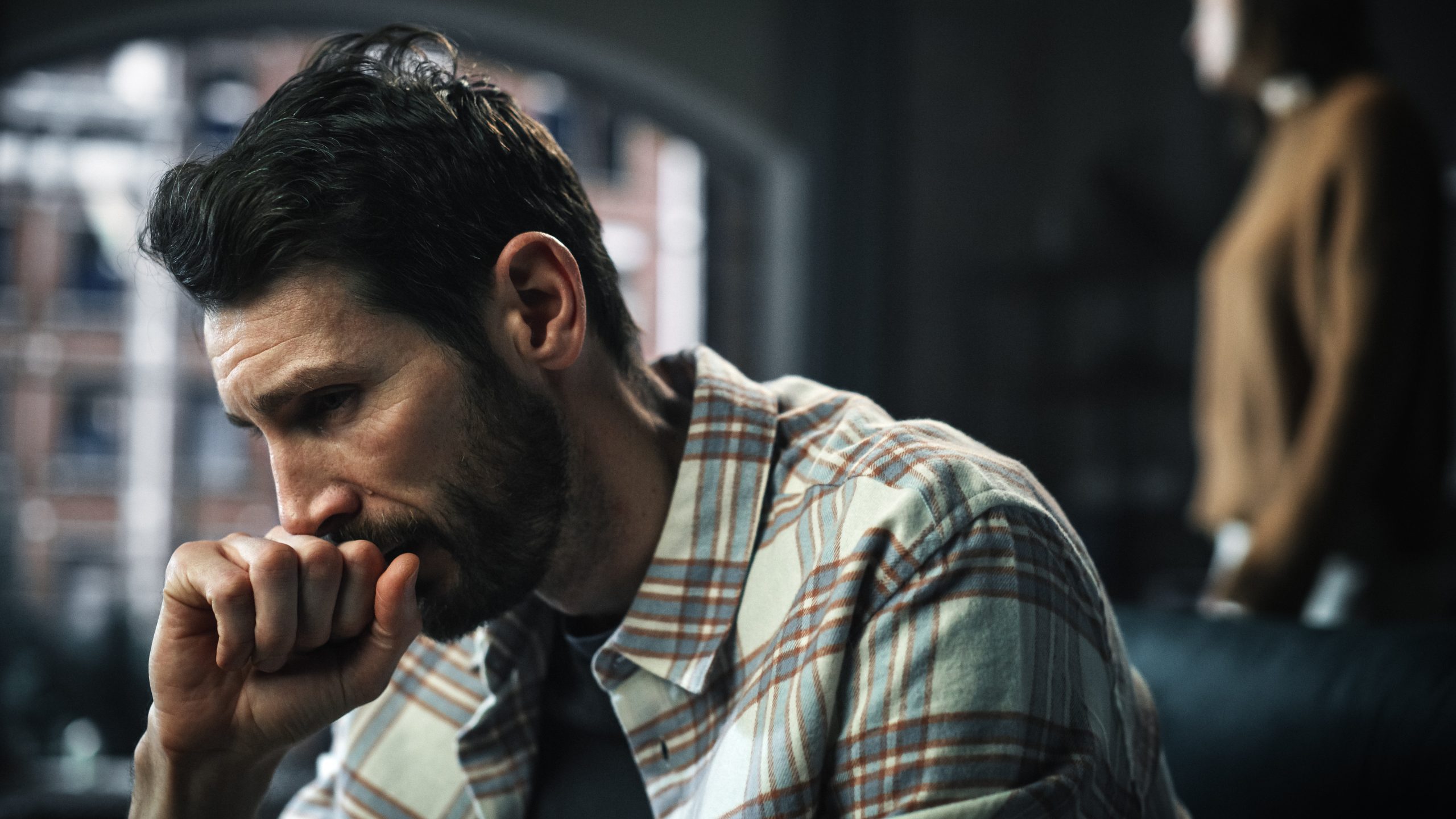 Portrait of Fragile Crying Man being Harrased and Bullied by Partner. Couple Arguing and Fighting Violently. Domestic Violence, Emotional Abuse, Toxic Behavior. Rack Focus with Girlfriend Screaming